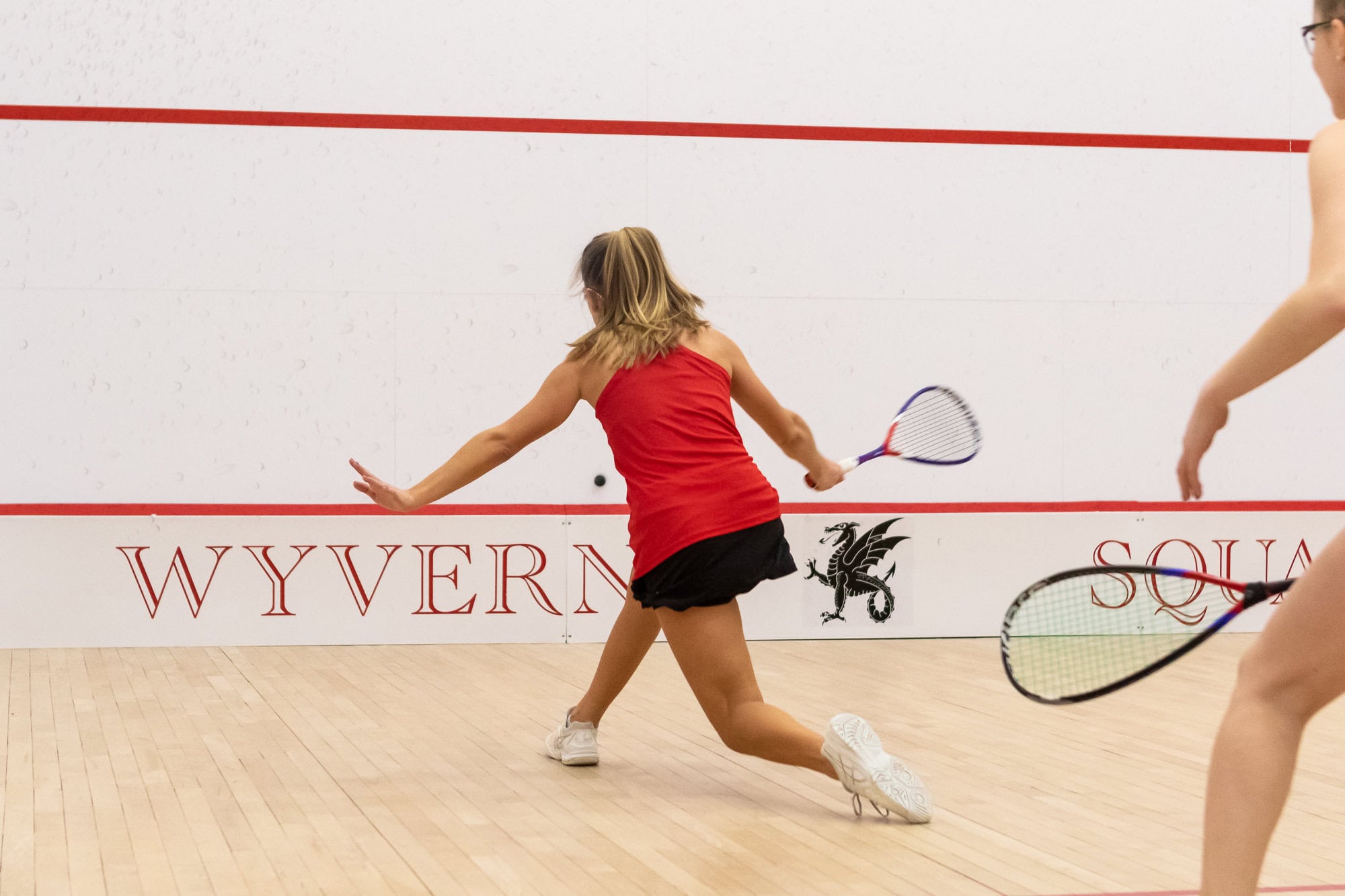 Girls Squash Girls play competitive sports and squash at Kingswood Oxford in West Hartford