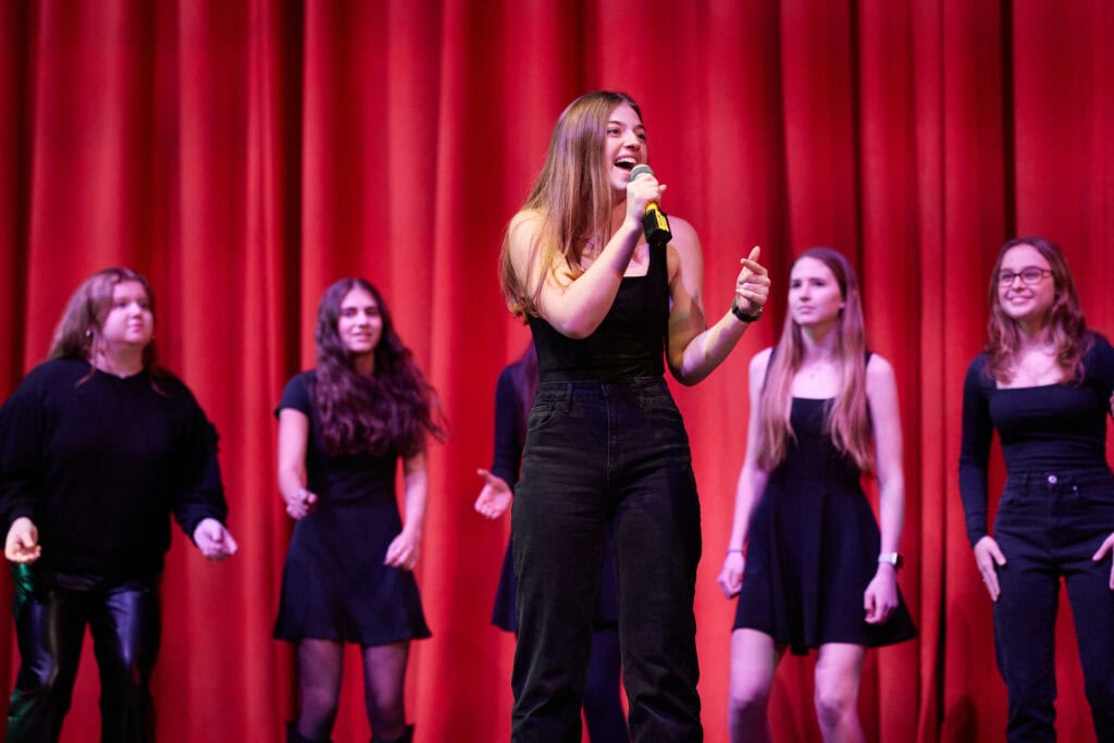 Students at Kingswood Oxford in Hartford perform in an a cappella festival and workshop with professional vocalists.