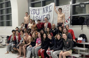 Coach Kraus at Kingswood Oxford School in West Hartford was awarded a distinguished service award by the New England Prep School Swim League and cheered by his athletes.